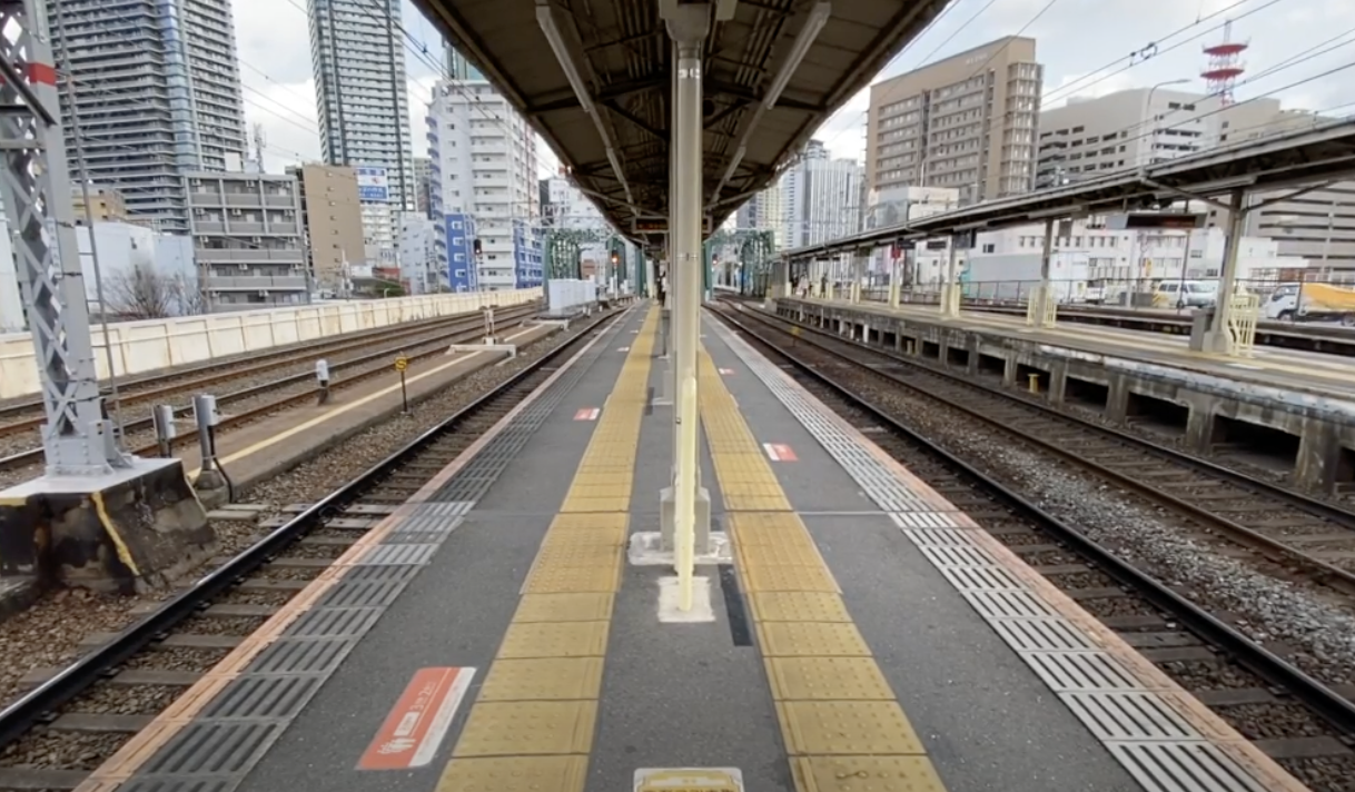 Tiny Nakatsu Station platform showing the dramatic contrast to Umeda
